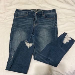 American Eagle jeans with holes and frayed edges